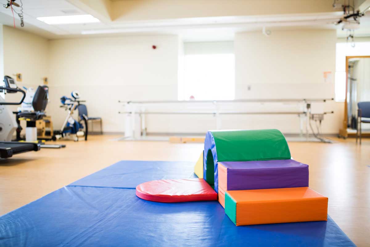 A rehab space with padded colour blocks.