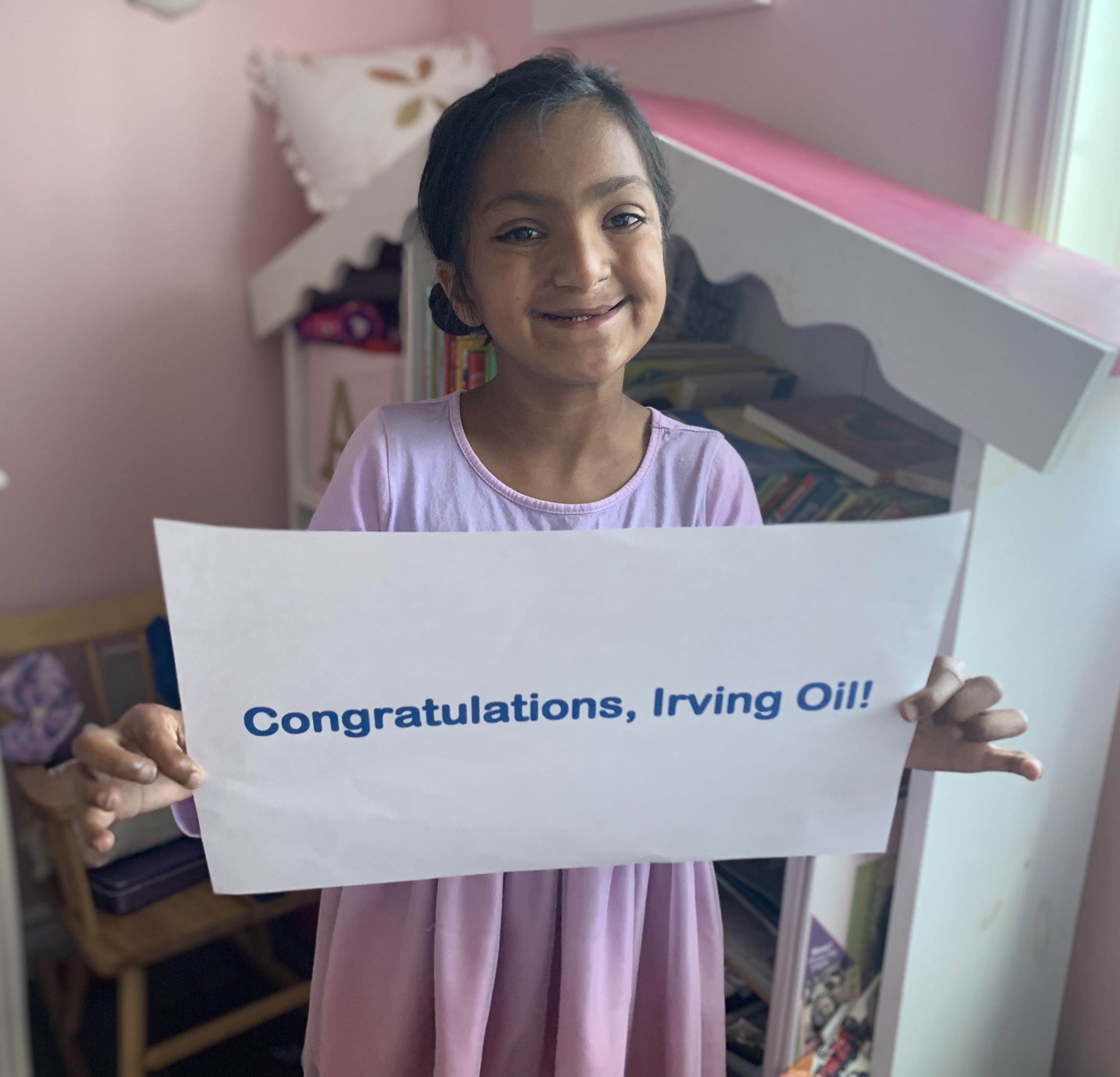 Norah Matchett, IWK Patient, congratulates Irving Oil