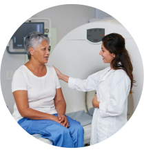 Two women, a doctor and a patient, in a medical setting.