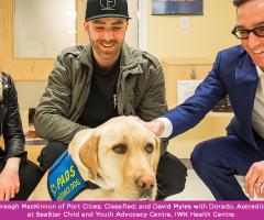Breagh MacKinnon, Classified, and David Myles with Dorado, accredited Facility dog