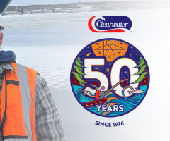 Workers in hard hats hold a $7,471.80 Clearwater Cares donation cheque for IWK Health.